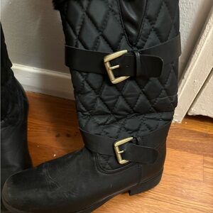 Size 9 black target boots. Lightly worn, some visible wear and tear.